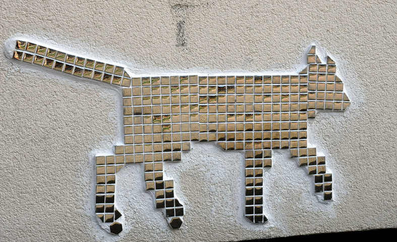 Pikseļkaķis, kurā atstarojas un spēlējas gaisma.